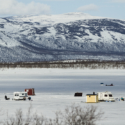 ice fishing on a frozen lake